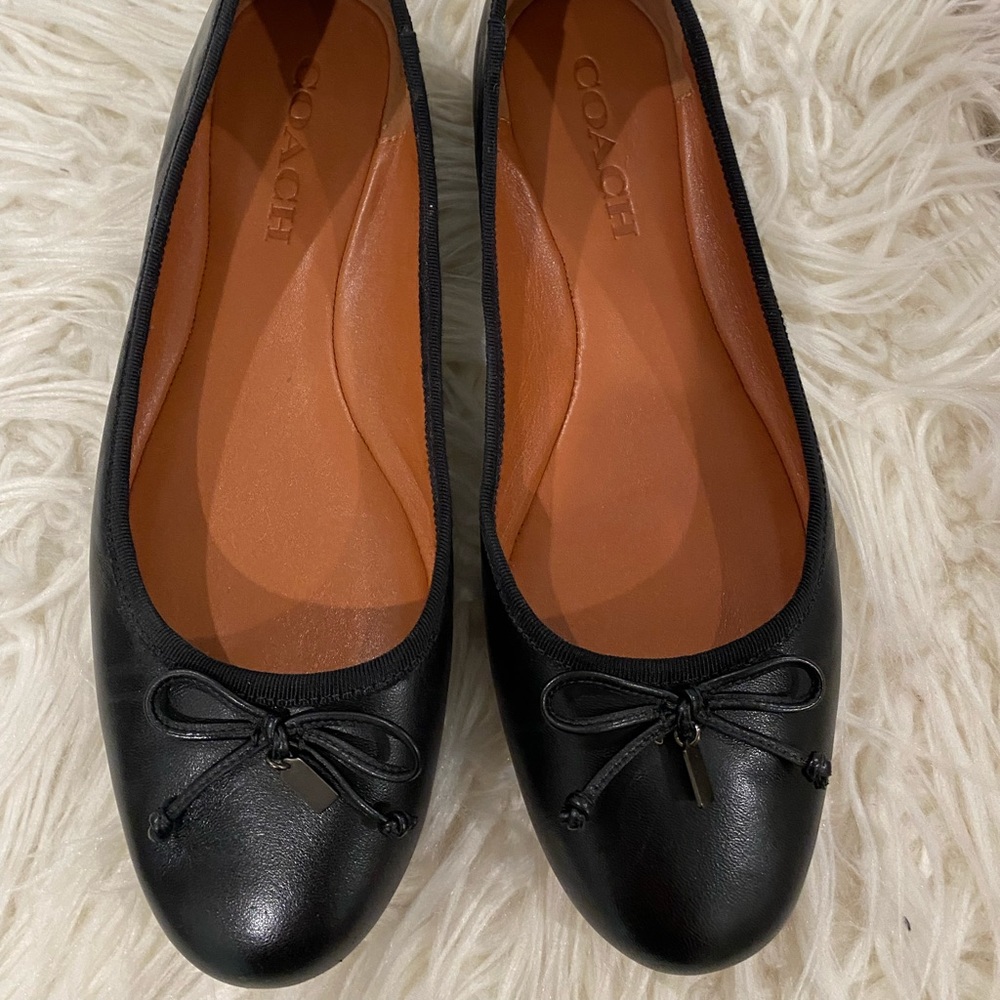 Coach flats.